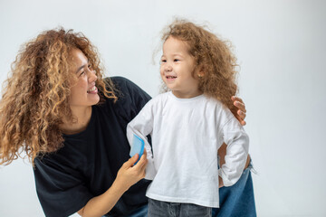 Mom brushes her daughter