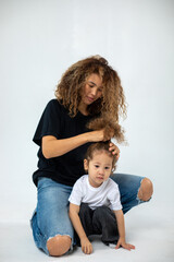 Happy loving family. Mother and her daughter child girl playing and hugging.