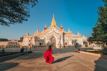 Couple visits Ananda Temple, a beautiful Burmese temple, in the morning.