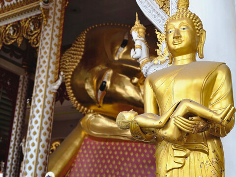 golden Buddha statue has dust on it at Wat Rat Prakong Tham, Nonthaburi Province.