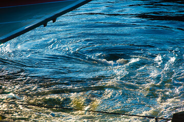 Whirlpool in the wake of a ferry leaving port.