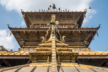Beautiful view of the golden temple in Patan, unique Buddhist monastery in north of Durbar Square, Kathmandu of Nepal.