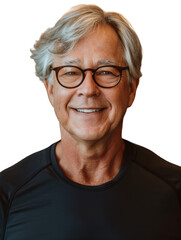 A smiling, middle-aged man with grey hair and glasses in a black training shirt with a transparent background