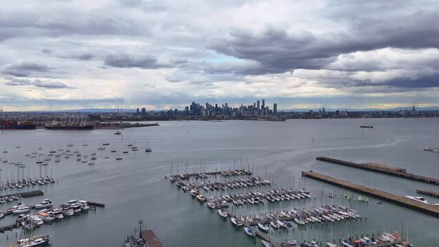 Melbourne skyline view from williamstown on a cloudy day