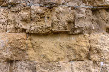 Texture of an ancient brick wall made of sandstone. Archaeological excavations 3