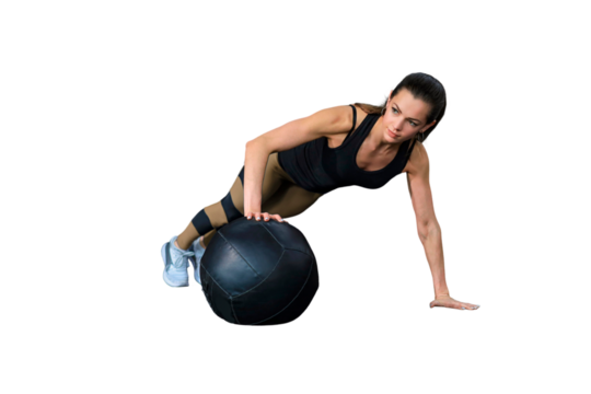 Fit and muscular woman exercising with medicine ball on a transparent background