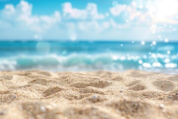 Background of blue sky and sea blurred into bokeh on a sandy beach.
