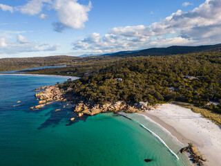St Helens, Australia: Dramatic aerial view of the stunning coast of Bay of Fires with white sand...
