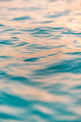 Beautiful sea waves ripples and sky reflection at sunset sunlight. Dream nature, beauty in nature ocean ecology concept. Artistic golden pastel blue fluid background. Closeup abstract natural light - 790610357