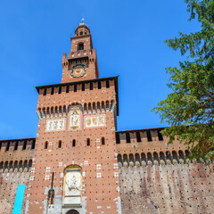 Exterior view clock tower of the Sforza Castle. It was built in the 15th century. Close-up with details. View, details, architectures and embellishments.