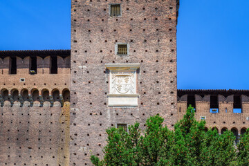 Castello Sforzesco (Sforza Castle) in Milan, Lombardy, Italy. Walls and towers close-up. View,...