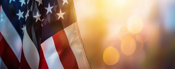 closeup of an American flag with copy space on a blurred bokeh background - obrazy, fototapety, plakaty