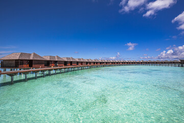 Maldives water villas paradise background. Tropical landscape, seascape with long pier, water villas, amazing sea sky and lagoon beach, tropical nature. Exotic tourism destination, summer vacation - 790613124