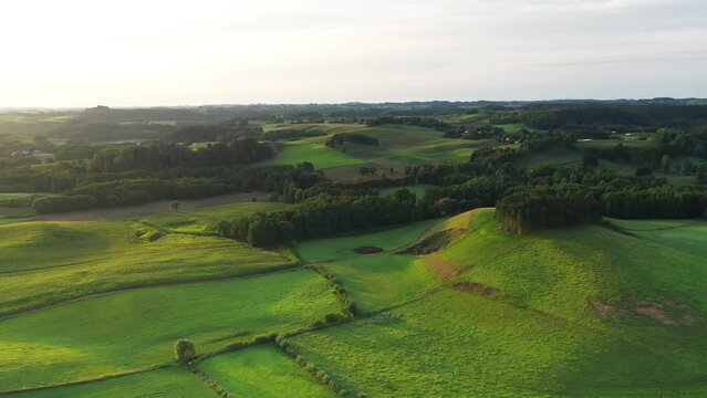 Aerial landscape with green fields and hills	