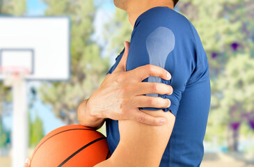 Basketball player with a shoulder injury at oudoors