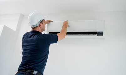 technician cleans air conditioner system in a modern apartment. - 790625122
