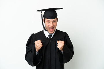 Young university Russian graduate isolated on white background celebrating a victory in winner...