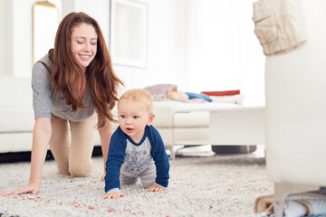Mom, baby and crawling for childcare with support, love and cute as toddler for growth and child development. Parent, kid and happy at home with playing for bonding, childhood memories and fun