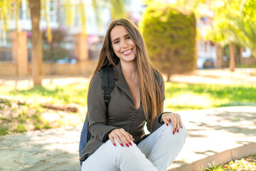 Young woman at outdoors with happy expression