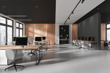 Modern coworking interior with tables and pc desktops, panoramic window - 790639194