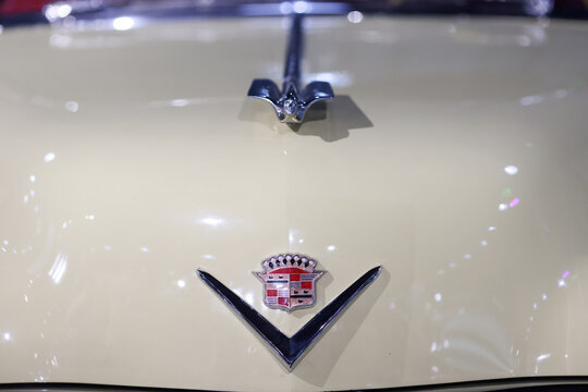 Details with the front part and emblem of a retro 1950 Cadillac series 62 convertible retro car.