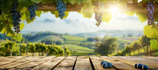 Foto op Canvas Rustic Wooden Table with Vineyard Backdrop © M.Gierczyk