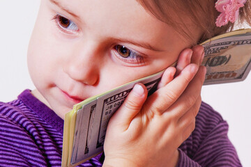 Kids financial literacy concept. Portrait of baby girlwith US Dollar bills. - 790641595