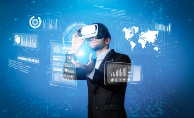 Skilled business man looking data analysis while planning strategy by using visual reality glasses....