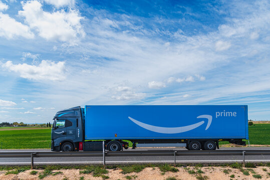 Murcia, 4/16/2024; Amazon truck powered by natural gas driving on a highway, side view.