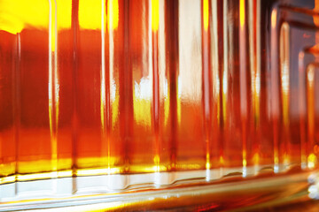 Rich glass texture of luxury cognac bottle in detail backdrop - 790647103