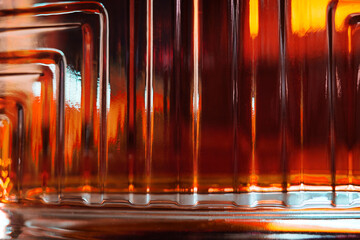 Rich glass texture of luxury cognac bottle in detail background