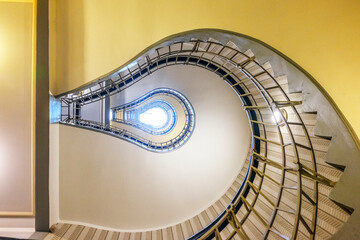 Spiral staircase of a residential building in the shape of a light bulb.