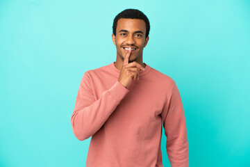 African American handsome man on isolated blue background showing a sign of silence gesture putting finger in mouth