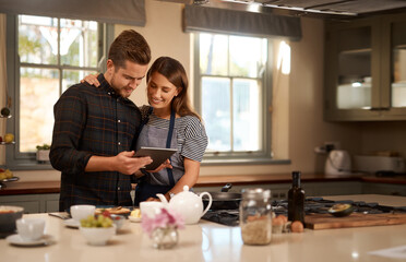 Couple, cooking and tablet for online recipe in home or ingredients on digital food app, meal or...
