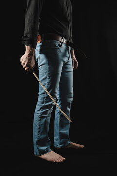 Strict man with rattan cane.
