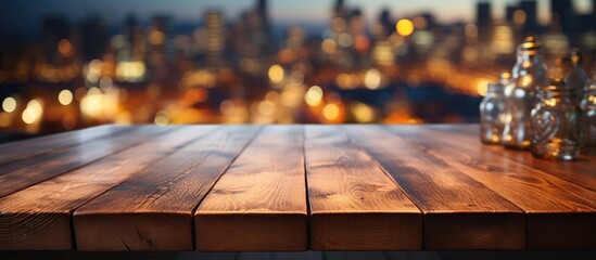 Empty wooden table for product display montages with cityscape background.
