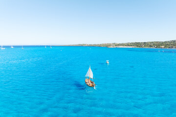 Sail yacht on the sea as a background. .Sea and waves from top view. Blue water background from top...