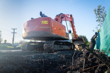Bulldozer working on a residential construction site. Low angle view. - 790665739