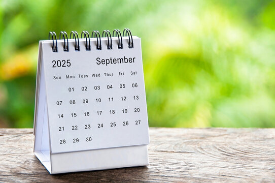 September 2025 white table calendar with customizable space for text. Calendar concept