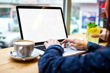 Computer mockup image blank screen with white background for advertising, with hand using laptop...