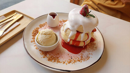 Japanese strawberry souffle pancake with vanilla ice cream.