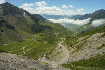 Col du Tourmalet hairpin turn road panoramic view, highest mountain pass in Pyrennes, famous Tour de France climb, France