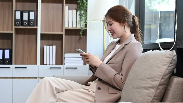 Business woman using tablet and laptop for doing math finance on an office desk, tax