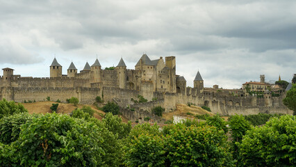 Carcassone castle with ramparts and towers panoramic view, popular tourist landmark in France - obrazy, fototapety, plakaty