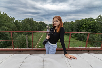 Portrait of a young beautiful red-haired girl.