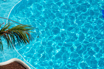 Swimming pool bottom caustics ripple and flow with waves background. Summer background. Texture of water surface. Overhead view. - 790688329