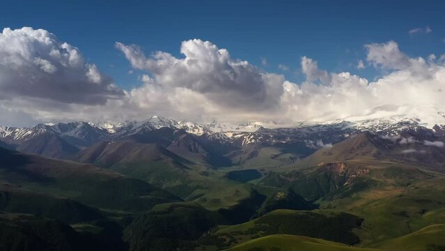 Elbrus Region. Flying over a highland plateau. Beautiful landscape of nature. Mount Elbrus is visible in the background.