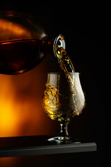 Cognac or brandy being poured into a glass.