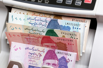 Pakistani rupee in a counting machine
