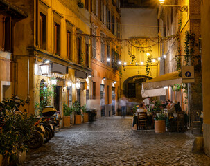 Night cozy old street in Trastevere in Rome, Italy. Trastevere is rione of Rome, on west bank of Tiber in Rome. Architecture and landmark of Rome - 790701318